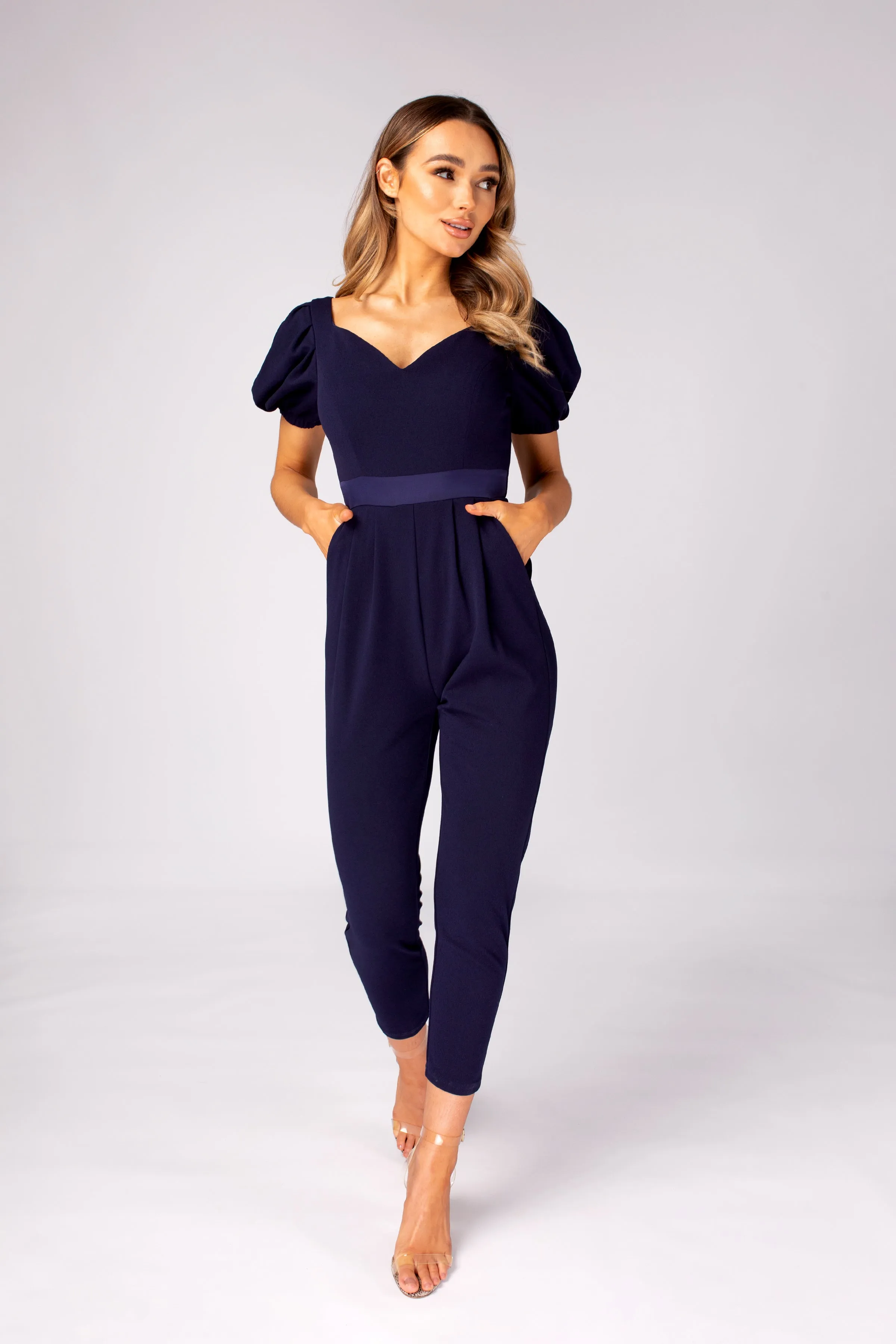 Navy jumpsuit with puff sleeve and back tie